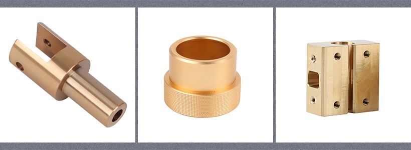 Three brass machined parts: a L-shaped bracket, a bushing with knurled edges, and a rectangular block with a groove